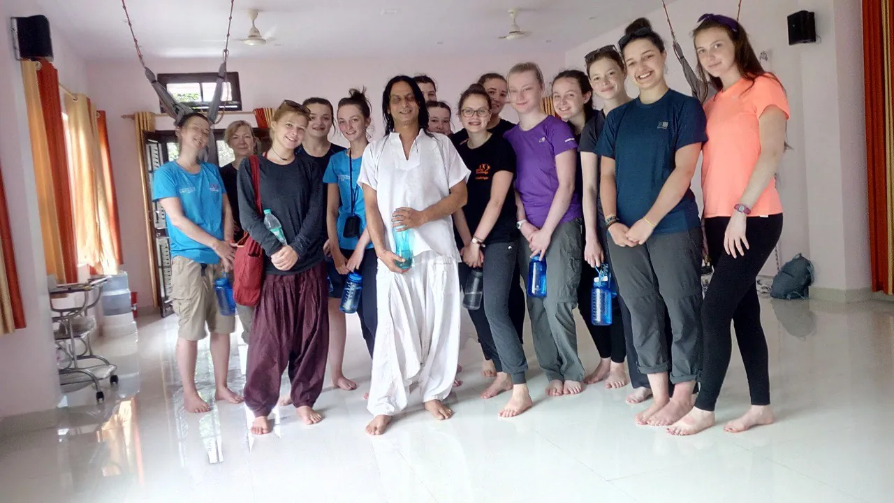 Yogi Shri G. Niranjan with a group of students in the practice hall in Rishikesh